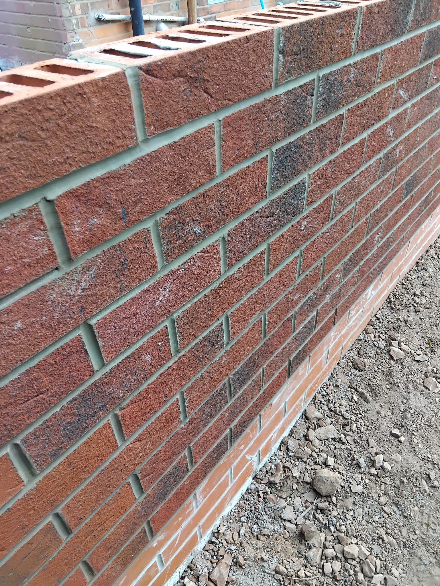Red brick wall with soldier course detail