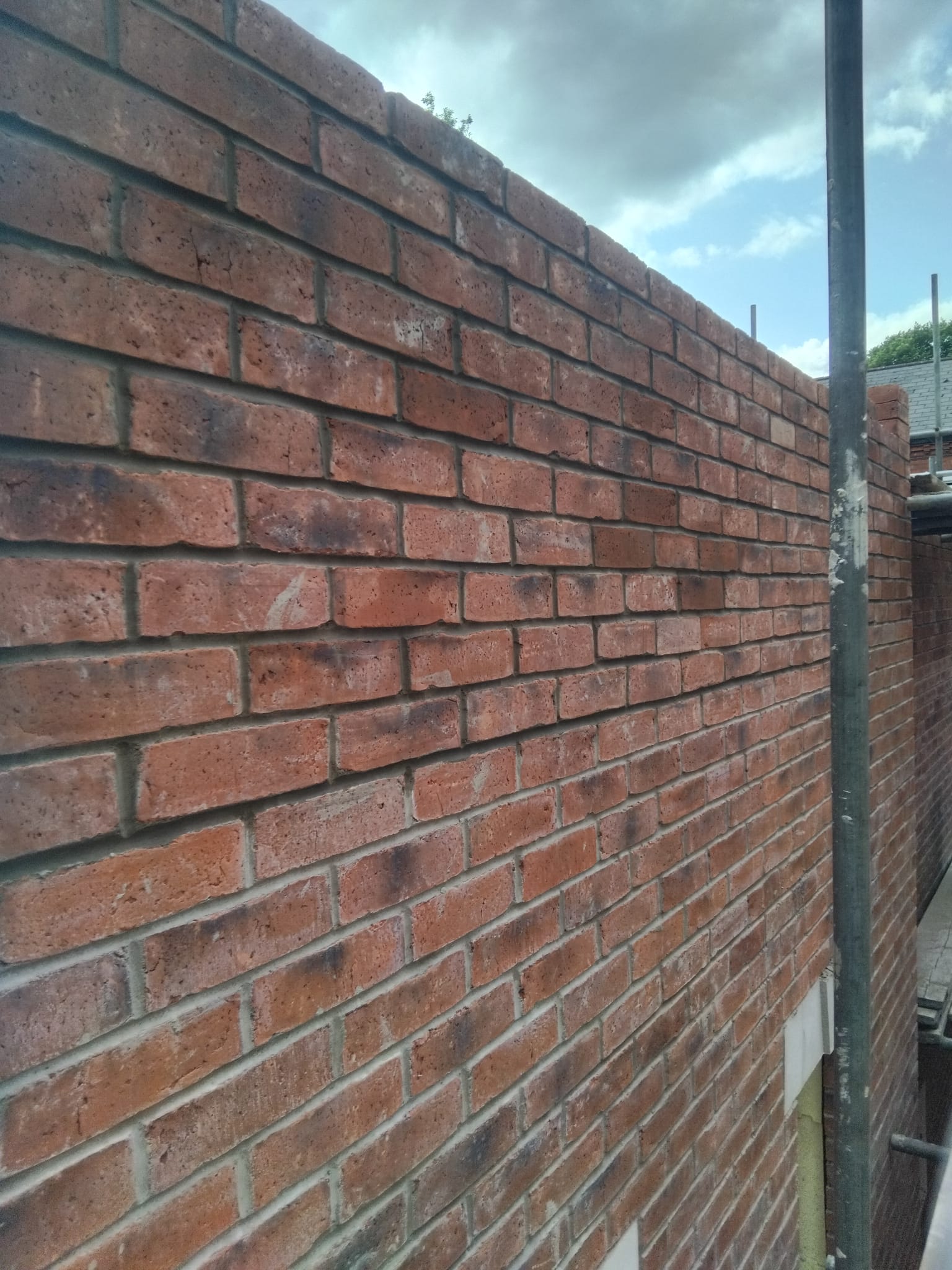 Long red brick boundary wall