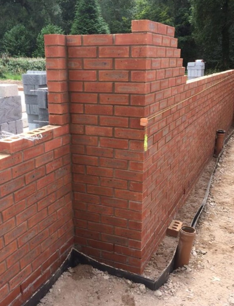 Stepped red brick pier corner detail