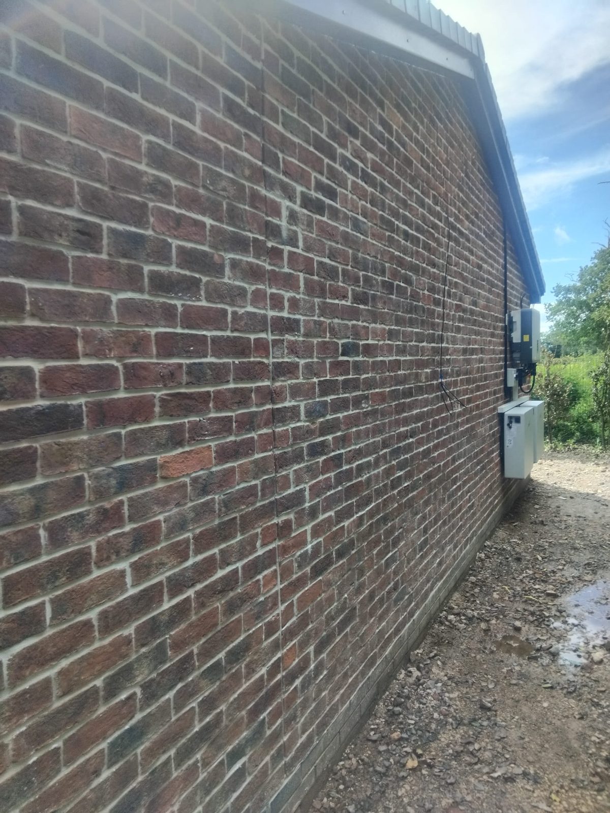 Red brick facing wall built by C.M Brickwork