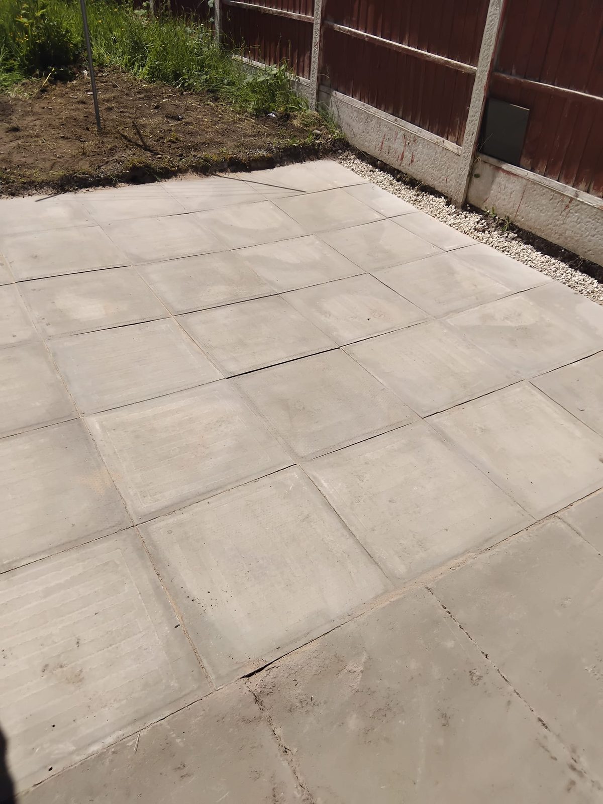 New paving and boundary fence on a finished job