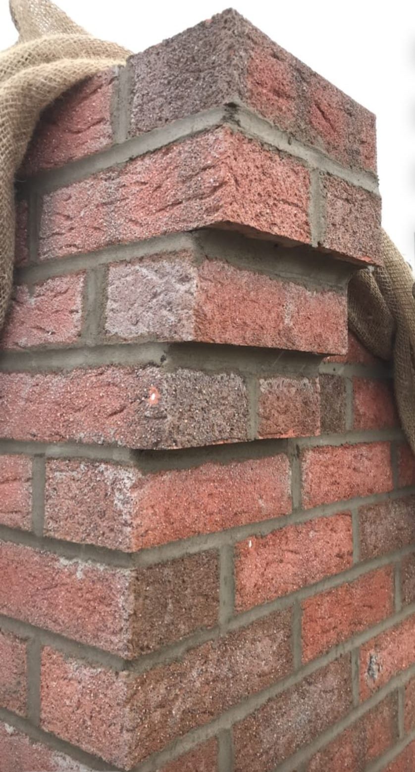 Stepped red brick pier corner detail